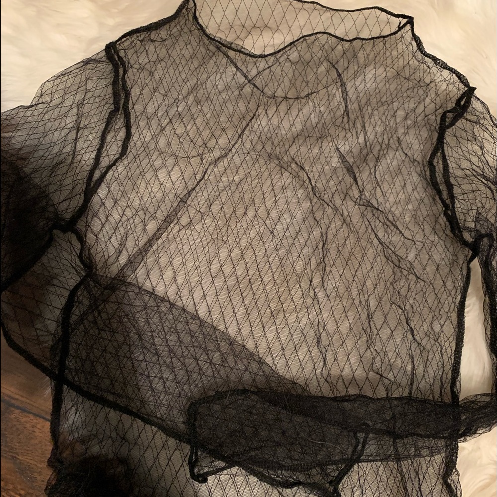 You can wear this under a crop top or dress